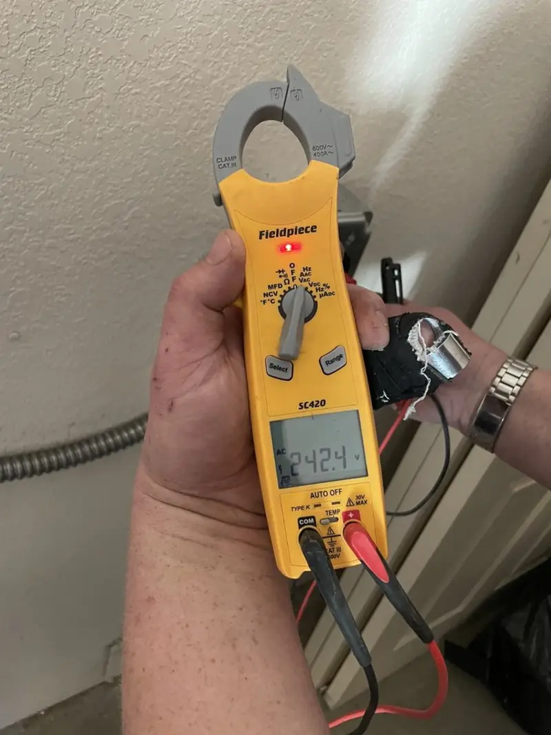 Voltage testing with clamp meter during Outlet Installation in Frankford